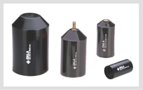 Four black moulded end caps in ascending sizes, two domed and two straight-sided, each carrying a printed GALA mark, one fitted with a brass valve stem at the top.